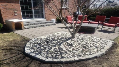 2021-Riverstone-garden-and-natural-stone-border-beside-patio-pad-in-backyard