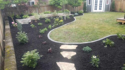 2021-a5-New-plants-added-to-large-backyard-garden-with-flagstone-access-path-to-side-gate