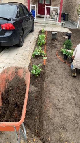 2021-e1-Before-garden-bed-installation-with-sod-beside-driveway-