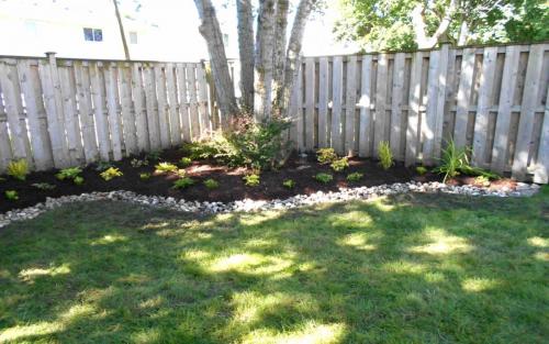Backyard Garden Bed with River Stone Border1