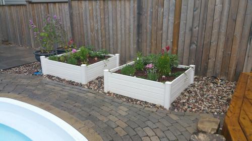 Raised Garden Bed Design with River Stone