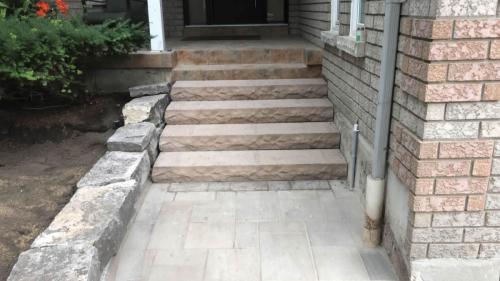 2021-Wide-stone-staircase-made-from-natural-stone-and-natural-stone-garden-wall-Unilock-Ledge-stone-step-buff