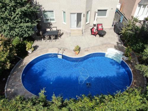 2021-c2-After-hardscaping-overhaul-around-pool-in-Ajax-Techno-Bloc-Blu-60-Chestnut-brown-with-Chocolate-brown-border