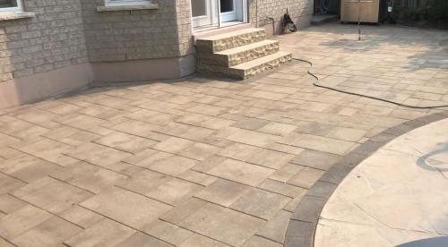 2021-c2a-Large-interlock-patio-around-pool-deck-and-natural-stone-steps-into-home-Ajax-Techno-Bloc-Blu-60-Chestnut-brown-with-Chocolate-brown-border