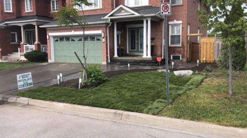 2021-h1-Interlock-extension-beside-driveway-in-Ajax-with-new-sod-and-garden-beds-Unilock-Beacon-Hill-Granite-fusion-with-wrap-around-steps