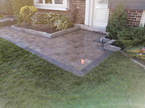 2021-n3-Replacement-interlock-path-and-natural-stone-garden-wall-in-Whitby-Unilock-Brussels-Sierra-with-Midnight-Charcoal-border