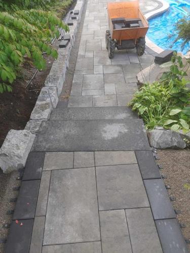 2021-q1-Replacement-interlock-path-with-natural-stone-garden-wall-in-backyard-pool-Pickering-Oaks-Rialto-Marble-Grey