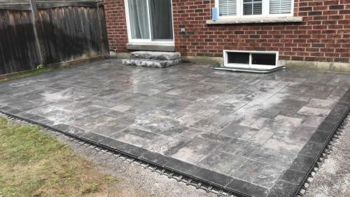 2021-s1-Small-patio-with-border-two-stone-steps-in-backyard-in-Whitby-Unilock-Beacon-Hill-Granite-Fusion