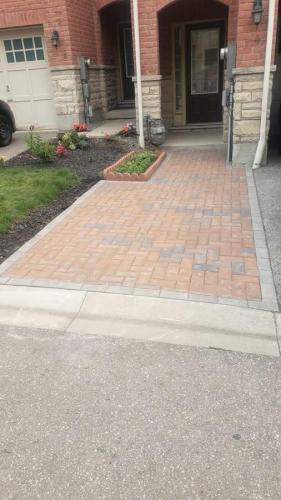 2021-t3-Finished-interlock-path-adjacent-to-driveway-incorporated-small-garden-and-red-colour-to-match-Unilock-Holland-Stone