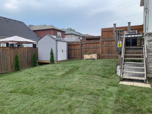 2021-Backyard-sod-project-graded-on-a-slope-in-Oshawa