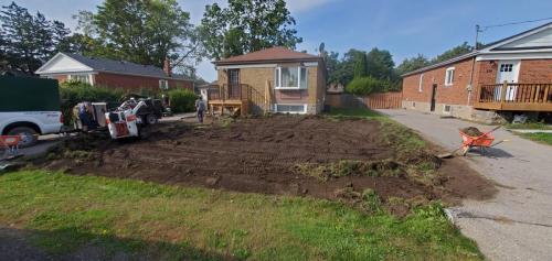 2021-n1-Beginning-of-front-yard-sod-project-in-Whitby-removal-of-old-grass-first-using-Bobcat