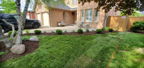 23 - Front yard gardens and sod install